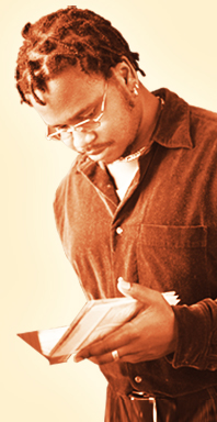 Young man standing and reading